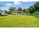 A spacious backyard with a well-maintained lawn surrounding the house at 1038 Blake Rd, Albemarle, NC 28001