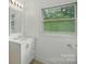 Bright bathroom with a sleek white vanity and new fixtures at 1038 Blake Rd, Albemarle, NC 28001