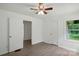 Bedroom with fresh paint, new flooring, ceiling fan, and natural light from a window at 1038 Blake Rd, Albemarle, NC 28001