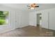 Bedroom with wood-look flooring, fresh paint, and two windows providing ample natural light at 1038 Blake Rd, Albemarle, NC 28001