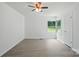 Bright bedroom featuring fresh paint, new flooring, large window, and a ceiling fan at 1038 Blake Rd, Albemarle, NC 28001
