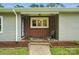 A covered front porch with brick accents and decorative ironwork is inviting at 1038 Blake Rd, Albemarle, NC 28001