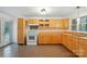 Functional kitchen with light wood cabinets and tile flooring at 1038 Blake Rd, Albemarle, NC 28001