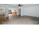 Large living room with new flooring and views into other areas of the house at 1038 Blake Rd, Albemarle, NC 28001