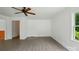 Bright living room with new flooring and view to the front yard at 1038 Blake Rd, Albemarle, NC 28001