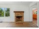 Bright living room with view to the side yard and fireplace at 1038 Blake Rd, Albemarle, NC 28001