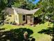 Charming home with screened-in porch, lush lawn, and beautiful landscaping in a serene, tree-filled setting at 105 Venus Ave, Gastonia, NC 28052