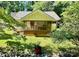 Charming home with inviting front porch nestled among lush greenery, showcasing curb appeal at 105 Venus Ave, Gastonia, NC 28052