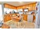 Bright kitchen featuring wood cabinets, modern appliances, and eat-in dining area with natural light at 105 Venus Ave, Gastonia, NC 28052