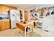 Efficient kitchen with wooden cabinets, a cozy breakfast nook, and ample storage solutions at 105 Venus Ave, Gastonia, NC 28052