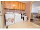 Laundry room equipped with washer, dryer, sink and cabinet storage for added convenience at 105 Venus Ave, Gastonia, NC 28052