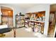 Well-organized pantry with wire shelving, offering plentiful storage adjacent to the kitchen and laundry areas at 105 Venus Ave, Gastonia, NC 28052