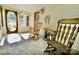 Relaxing sunroom featuring rocking chairs and natural light, perfect for enjoying the outdoors indoors at 105 Venus Ave, Gastonia, NC 28052