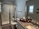Bathroom features marble tile shower with bench, toilet, and granite vanity countertop at 110 W Pine St, Lincolnton, NC 28092