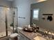 Bathroom featuring a marble tile shower with a bench, toilet, and granite vanity countertop at 110 W Pine St, Lincolnton, NC 28092