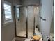 Bathroom with marble tile shower, toilet, shuttered window, and granite vanity at 110 W Pine St, Lincolnton, NC 28092