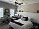 Functional bedroom featuring bed, exercise bike and desk area at 110 W Pine St, Lincolnton, NC 28092