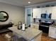 Modern kitchen featuring a center island, granite countertops, and stainless steel appliances at 110 W Pine St, Lincolnton, NC 28092