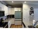 Bright kitchen featuring white cabinets, granite countertops, and stainless steel appliances at 110 W Pine St, Lincolnton, NC 28092