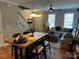 Inviting living room featuring a cozy couch, stairs, and natural light at 110 W Pine St, Lincolnton, NC 28092