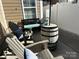 Cozy outdoor patio with comfortable seating, umbrella, and stylish barrel table at 110 W Pine St, Lincolnton, NC 28092
