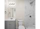 Updated bathroom featuring marble-look tile in the shower and modern fixtures at 1102 Venus St, Kannapolis, NC 28083