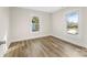 Bedroom features wood-look flooring, fresh paint, and abundant natural light at 1102 Venus St, Kannapolis, NC 28083
