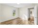Bright bedroom with wood-look flooring, fresh paint, and natural light at 1102 Venus St, Kannapolis, NC 28083