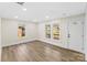 Bright living room featuring wood floors, white trim, and natural light from updated windows at 1102 Venus St, Kannapolis, NC 28083