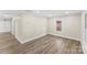 A versatile living room with light-colored walls, wood floors, and recessed lighting at 1102 Venus St, Kannapolis, NC 28083