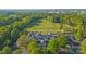 Aerial view of a country club surrounded by lush greenery and golf course, providing an ideal setting for recreation at 11209 Flenniken Ct, Charlotte, NC 28277