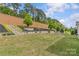 Terraced backyard with landscaping and fencing, offering a private outdoor space for relaxation and enjoyment at 11209 Flenniken Ct, Charlotte, NC 28277