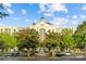 A view of the Ballantyne Hotel's exterior, showcasing its architecture and surrounding greenery at 11209 Flenniken Ct, Charlotte, NC 28277