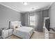 Bedroom with carpet, white bedding and furniture, and natural light through the windows at 11209 Flenniken Ct, Charlotte, NC 28277
