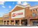 The exterior of a Crunch Fitness center with its red brick facade and prominent signage at 11209 Flenniken Ct, Charlotte, NC 28277