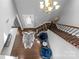 Elegant two-story foyer featuring hardwood floors, staircase, and decorative touches for a grand entrance at 11209 Flenniken Ct, Charlotte, NC 28277