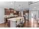 Spacious kitchen with a large island, stainless steel appliances, and hardwood floors, perfect for entertaining at 11209 Flenniken Ct, Charlotte, NC 28277