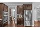 Well-equipped kitchen with stainless steel appliances, rich cabinetry, and sleek countertops for culinary enthusiasts at 11209 Flenniken Ct, Charlotte, NC 28277
