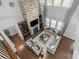 Aerial view of living room featuring a stone fireplace and elegant, gray furnishings at 11209 Flenniken Ct, Charlotte, NC 28277