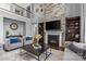 Spacious living room featuring a floor-to-ceiling stone fireplace and built-in shelving at 11209 Flenniken Ct, Charlotte, NC 28277