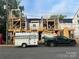 New construction townhomes are in progress with wood framing, ready for customization and modern finishes at 113 Verbena Ne St # 11, Charlotte, NC 28217