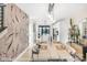 Open dining area with a large wooden table, modern lighting, and access to the kitchen at 113 Verbena Ne St # 11, Charlotte, NC 28217