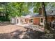 Brick home featuring a large patio and backyard at 114 Elmwood Dr, Salisbury, NC 28147
