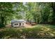 Aerial view of the backyard featuring trees and a patio at 114 Elmwood Dr, Salisbury, NC 28147