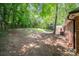 Large backyard featuring mature trees and a shed at 114 Elmwood Dr, Salisbury, NC 28147