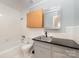Cozy bathroom featuring a tub-shower, vanity sink, and tile floor at 114 Elmwood Dr, Salisbury, NC 28147