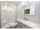 Bathroom featuring a shower, toilet, vanity, and window at 114 Elmwood Dr, Salisbury, NC 28147