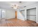 Bedroom with hardwood floors, closet, neutral walls, and doorway to a bathroom at 114 Elmwood Dr, Salisbury, NC 28147