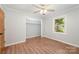 Comfortable bedroom with closet, hardwood floors, ceiling fan, and natural light at 114 Elmwood Dr, Salisbury, NC 28147
