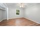 Bright bedroom with hardwood floors, a ceiling fan, and natural light at 114 Elmwood Dr, Salisbury, NC 28147